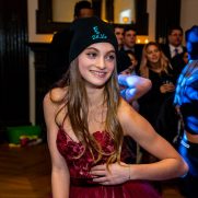 Girl wearing beanie at bat mitzvah dance